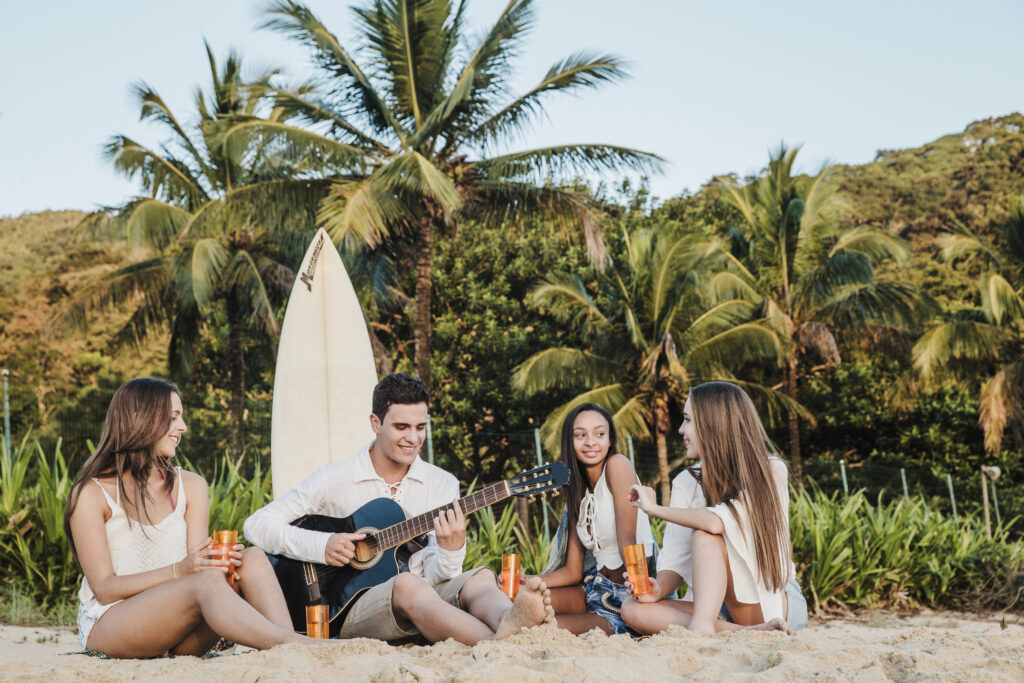 young-friends-playing-guitar-beach